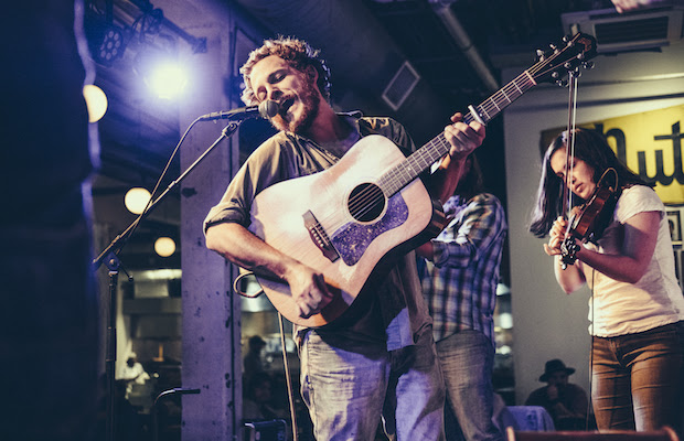 My Politic's Kaston Guffrey sings into the side of the microphone.