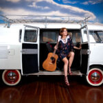 Shanna disembarks a van