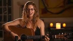 Shanna sings wearing glasses