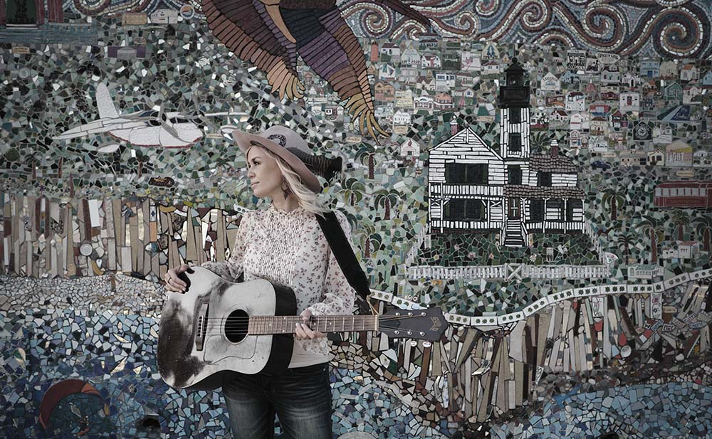 Sofia Talvik blends into a mosaic